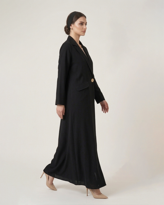 Woman wearing a black suit with a white background