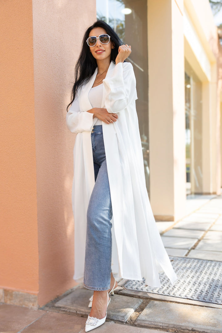 The White Orange Crepe Abaya with Buttoned Cuff Detail - Fabric Made from Orange Peel